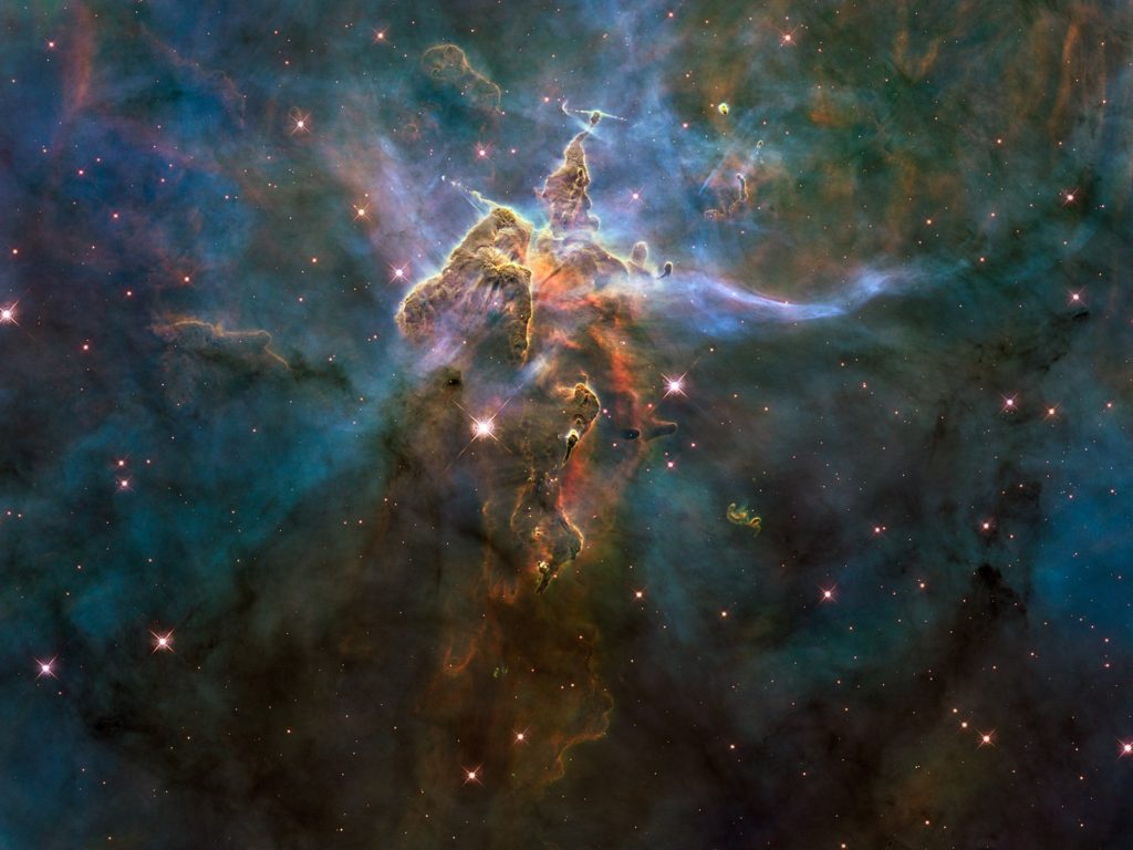 The eagle nebula: a mass of multicolored gaseous clouds, speckled with stunning stars. 